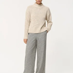 Pull court blanc en maille épaisse poche en biais